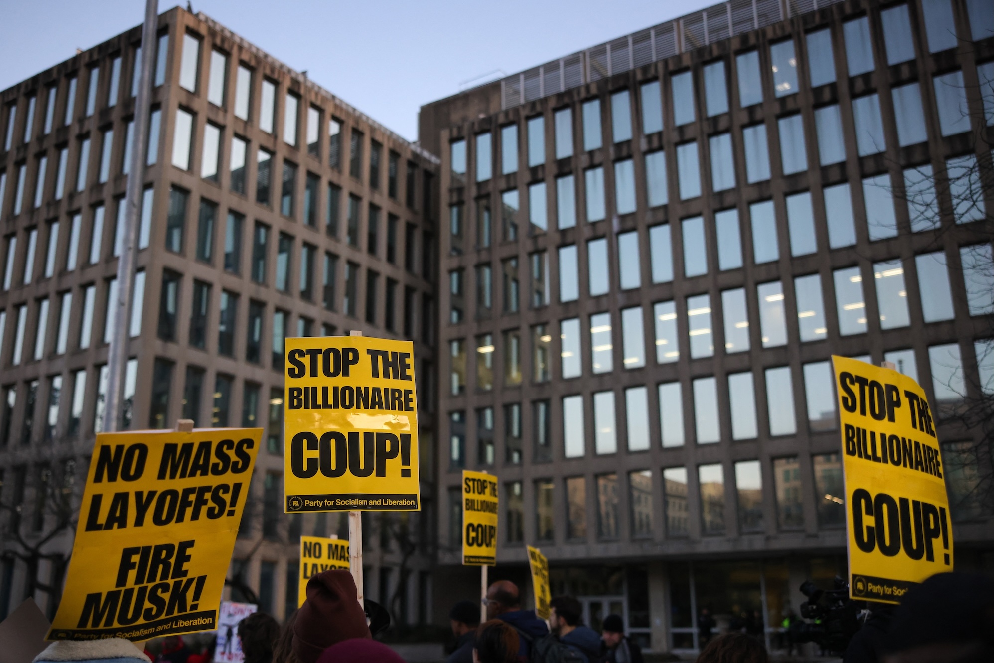 doge-social-security-administration-2197648668 Demonstrators gather outside of the Office of Personnel Management in Washington, D.C. on February 7, 2025 to protest federal layoffs and demand the termination of Elon Musk from the Department of Government Efficiency (DOGE). (Photo by Bryan Dozier / Middle East Images / Middle East Images via AFP)