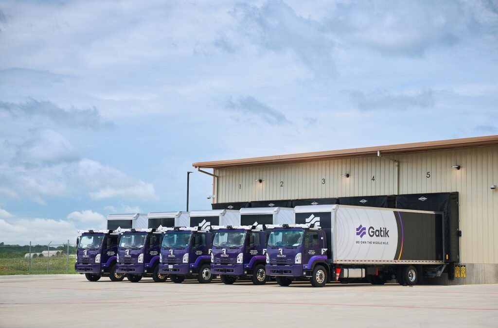 Gatik trucks backed up to loading bays