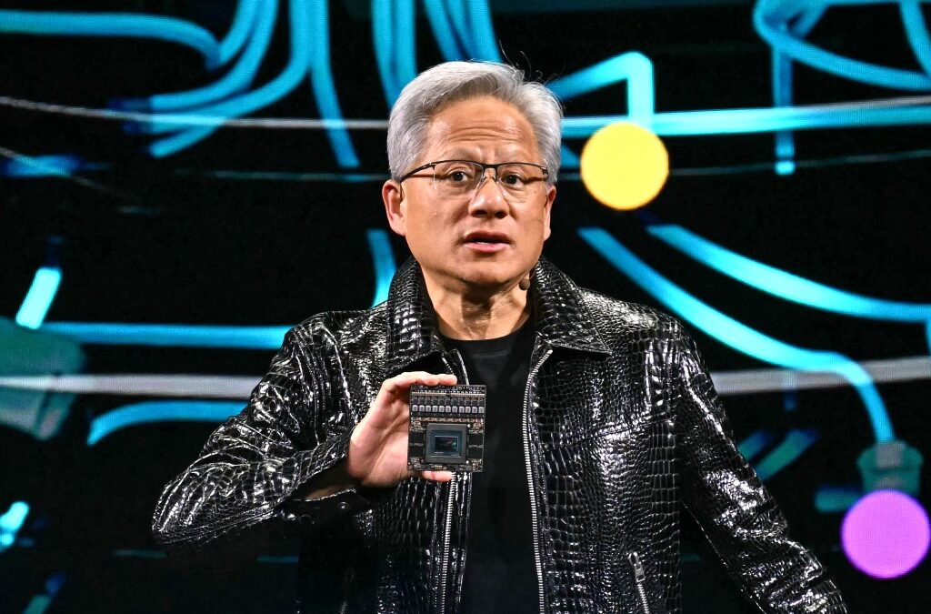 Jensen Huang holds up chip at CES 2025