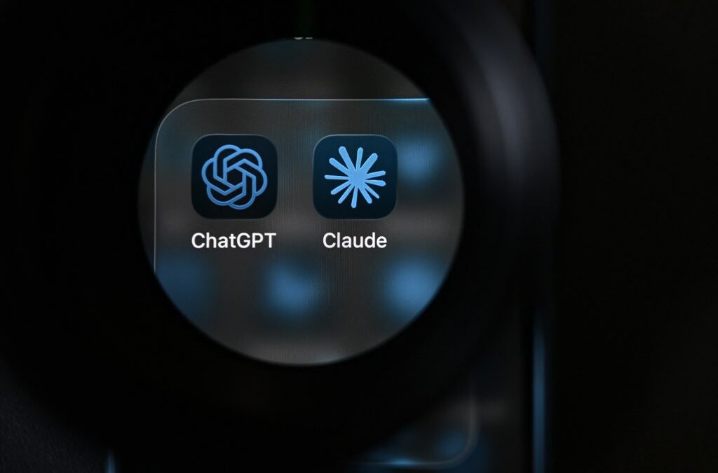 This photograph shows the app logos of artificial intelligence (AI) assistants ChatGPT and Claude on a smartphone's screen.