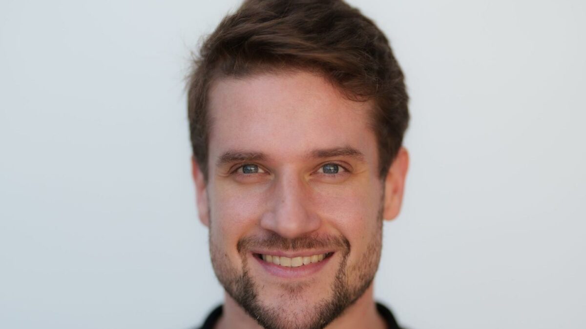 man smiles to camera