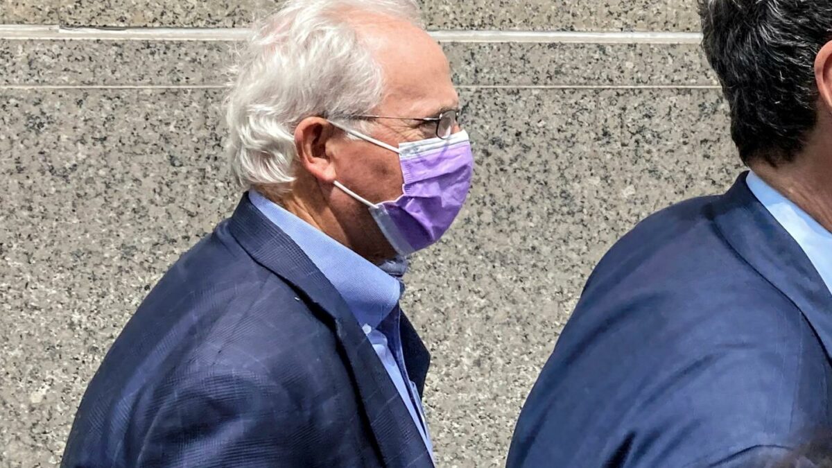 Former U.S. Rep. Stephen Buyer, left, trails his lawyer as he leaves Manhattan federal court after pleading not guilty to charges that he participated in an insider trading scheme while working as a consultant, July 27, 2022, in New York.