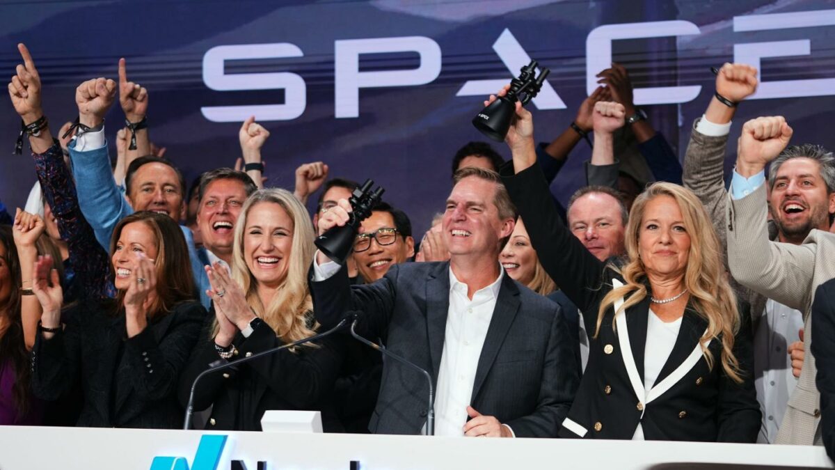 Gwynne Shotwell, President and COO of SpaceX, right, celebrates with colleagues during a bell ringing ceremony for the IPO of SpaceX at the Nasdaq MarketSite in New York, Friday, June 12, 2026, in New York.