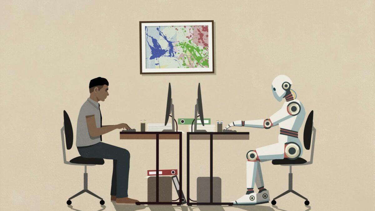 A man and robot sitting opposite each other.
