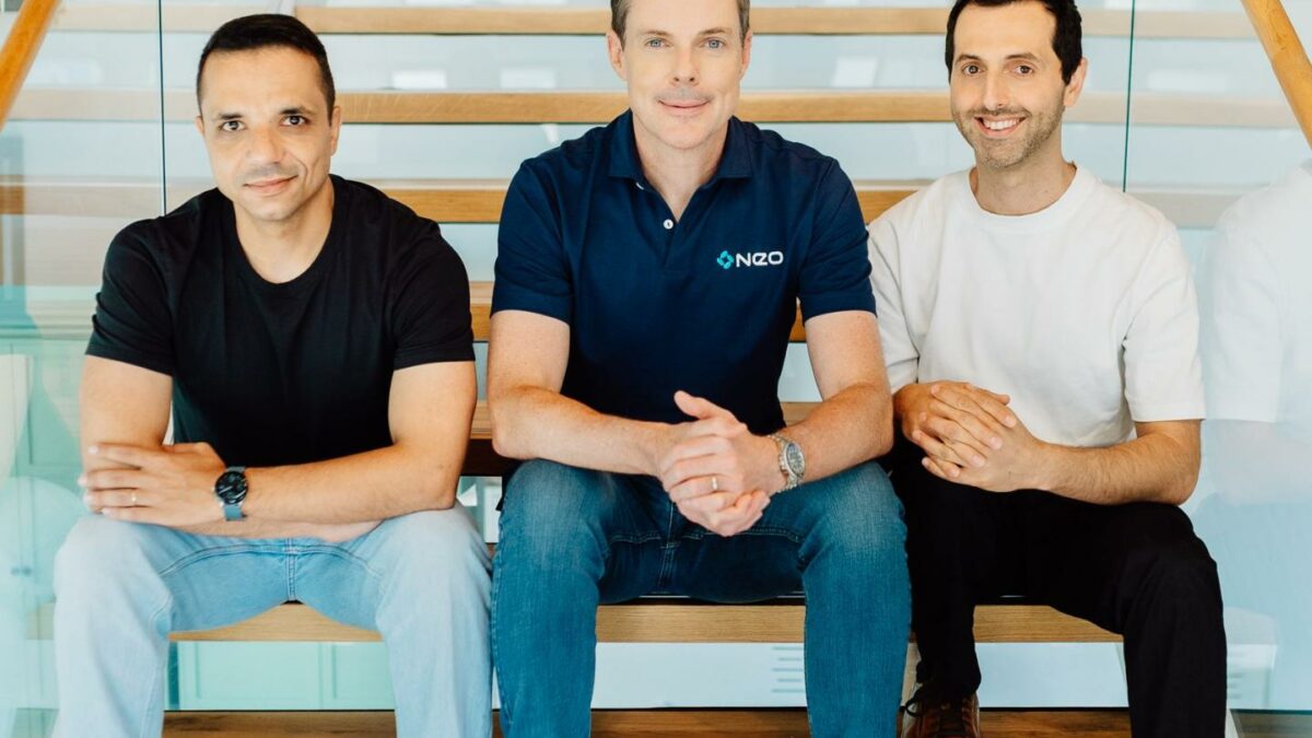 Three people sitting on stairs