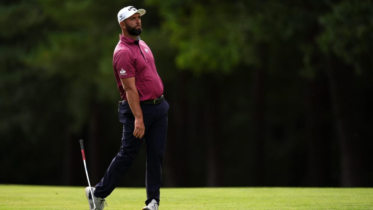 Jon Rahm of Spain drops his club on the 13th hole during the first round of the BMW Championship golf tournament in Virginia Water, England.