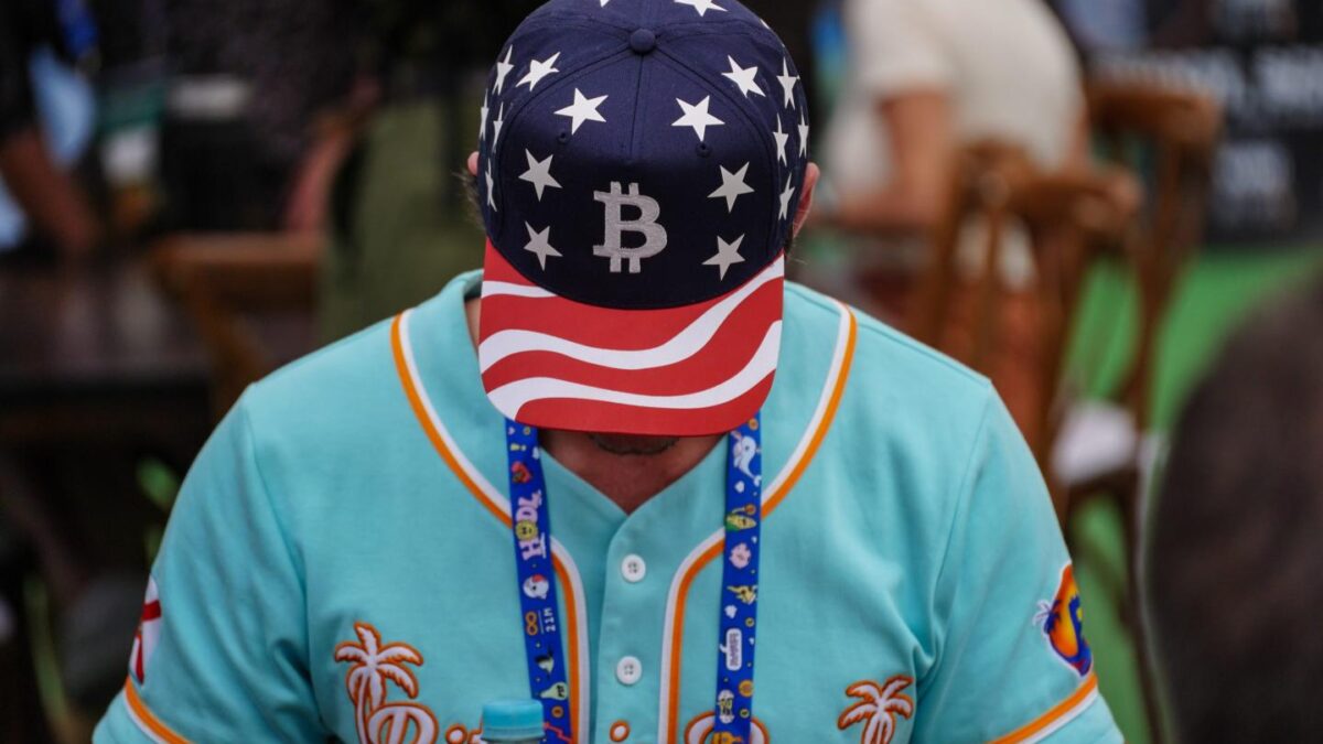 An attendee wears a Bitcoin hat on the exhibition floor during the Plan B Forum in San Salvador, El Salvador, on Jan. 31, 2025.