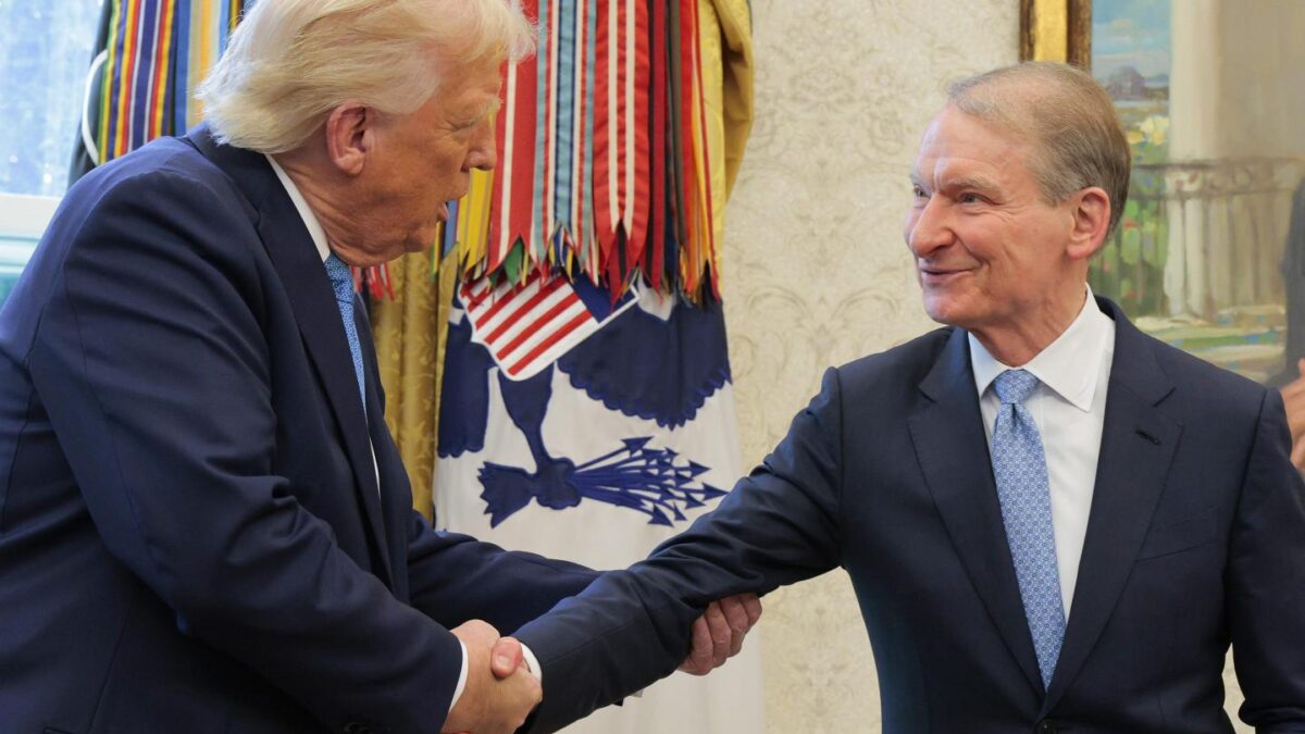 U.S. President Donald Trump shakes hands with Securities and Exchange Commission Chairman Paul Atkins during Atkins' swearing-in ceremony in the Oval Office at the White House on April 22, 2025 in Washington, DC.