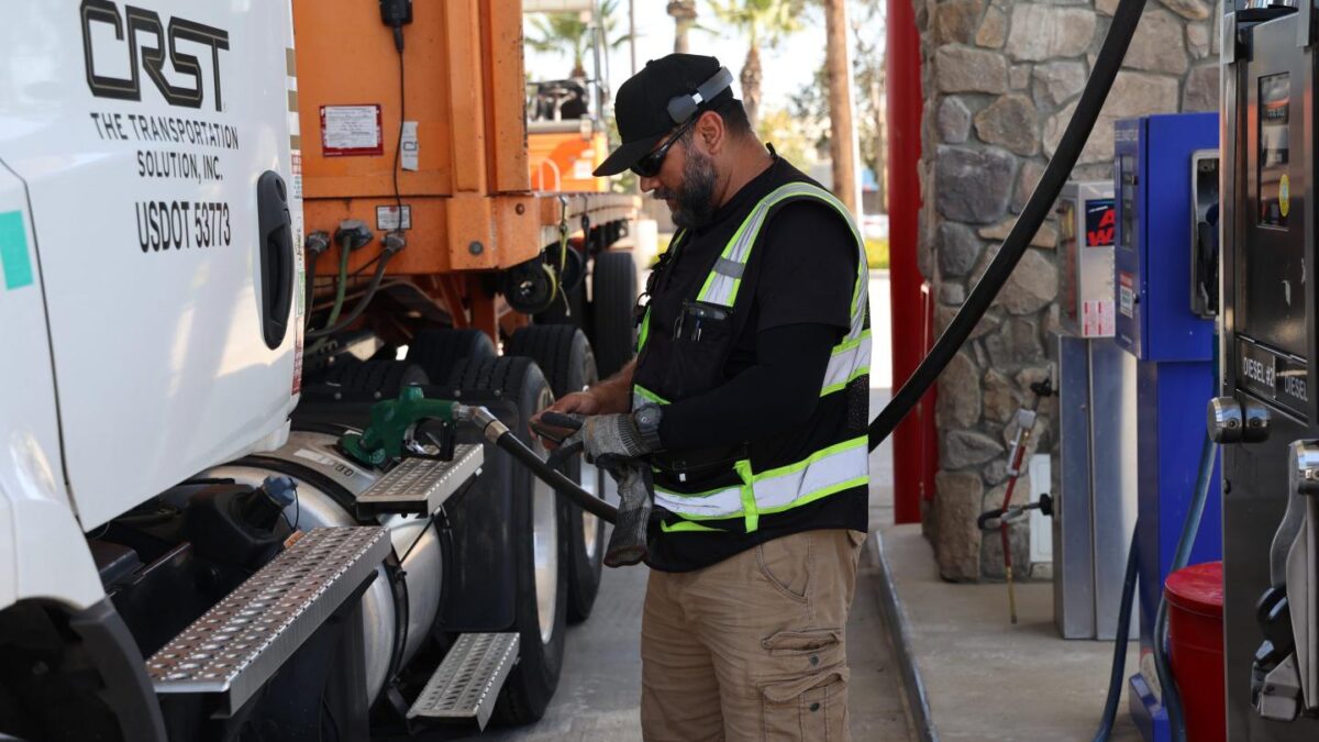 A driver filled up his truck at a gas station.