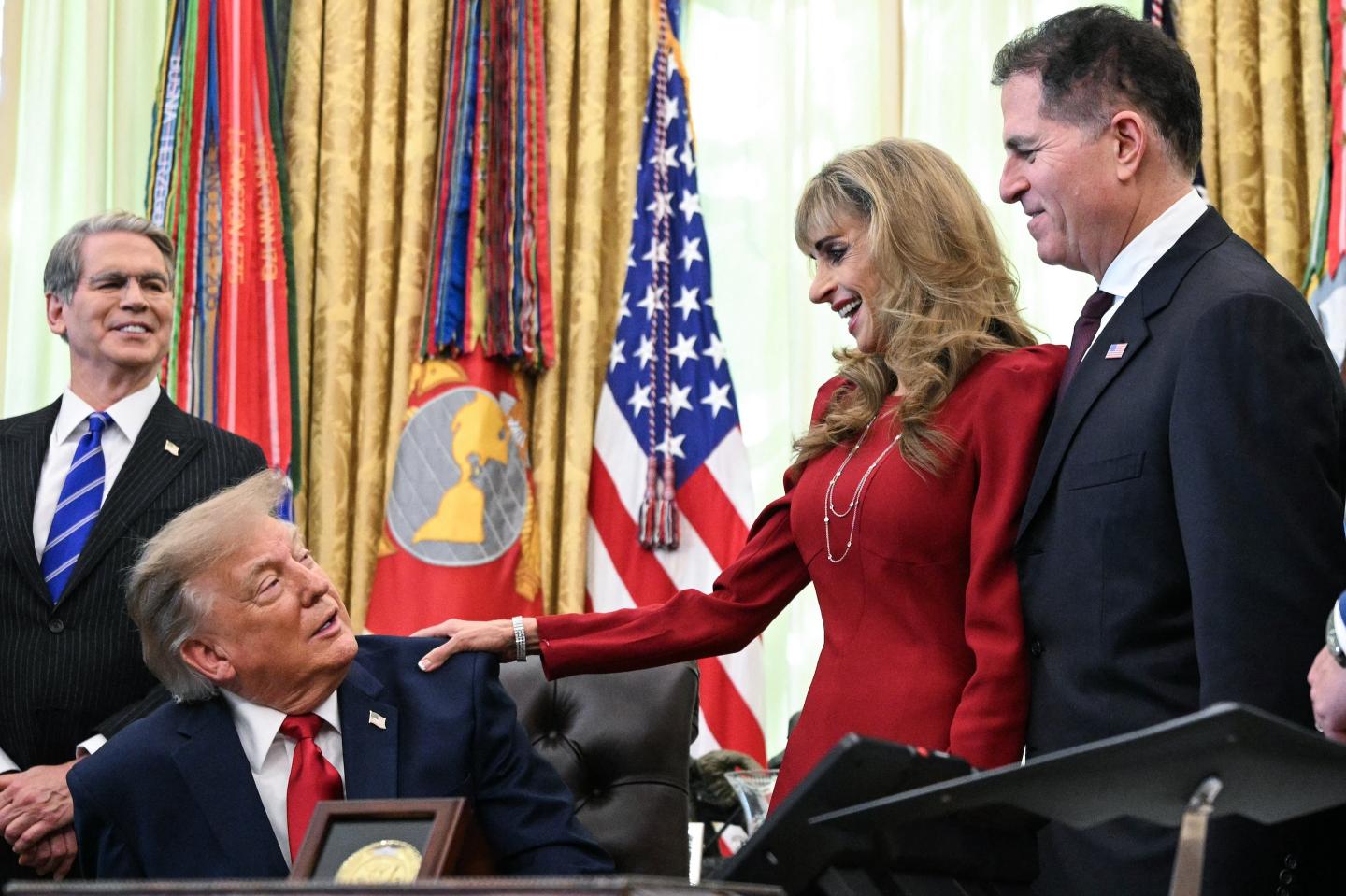 President Donald Trump, alongside Secretary of Treasury Scott Bessent (far left), Susan Dell (second from right), and Michael Dell (far right), speaks about Trump Accounts, investment savings vehicles for children, in the Oval Office on Oct. 7, 2026.