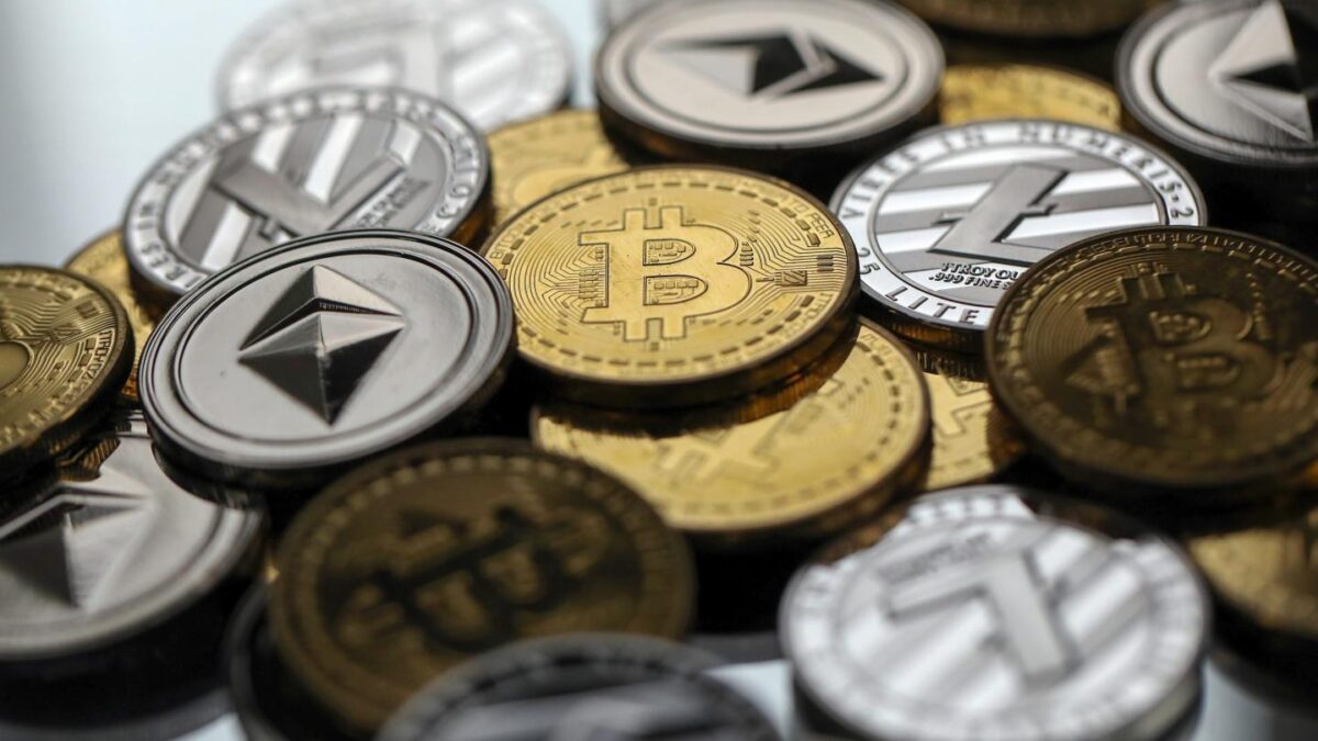 A display of physically cryptocurrencies including Bitcoin, Ethereum and Tether.